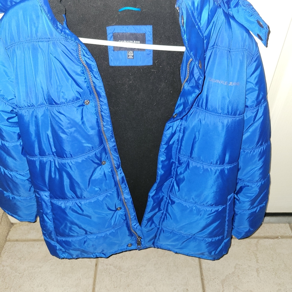 Vibrant blue puffy coat with warm black lining